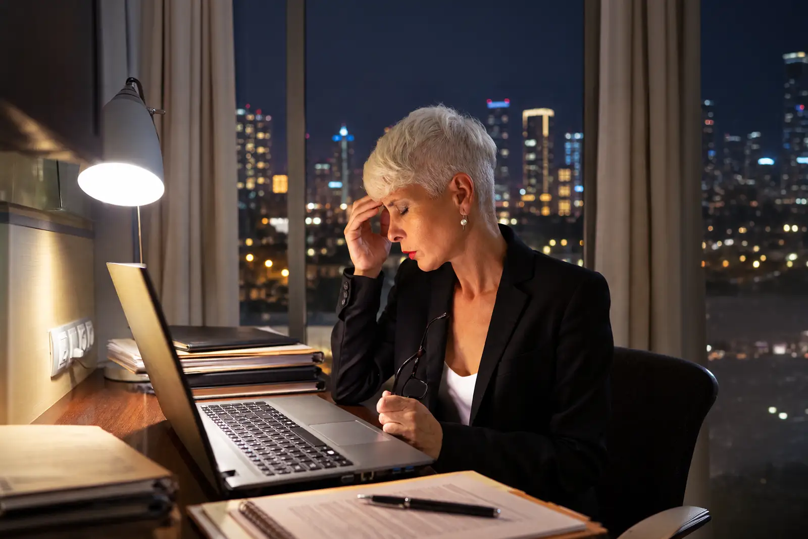 Executive working alone at night in an empty office