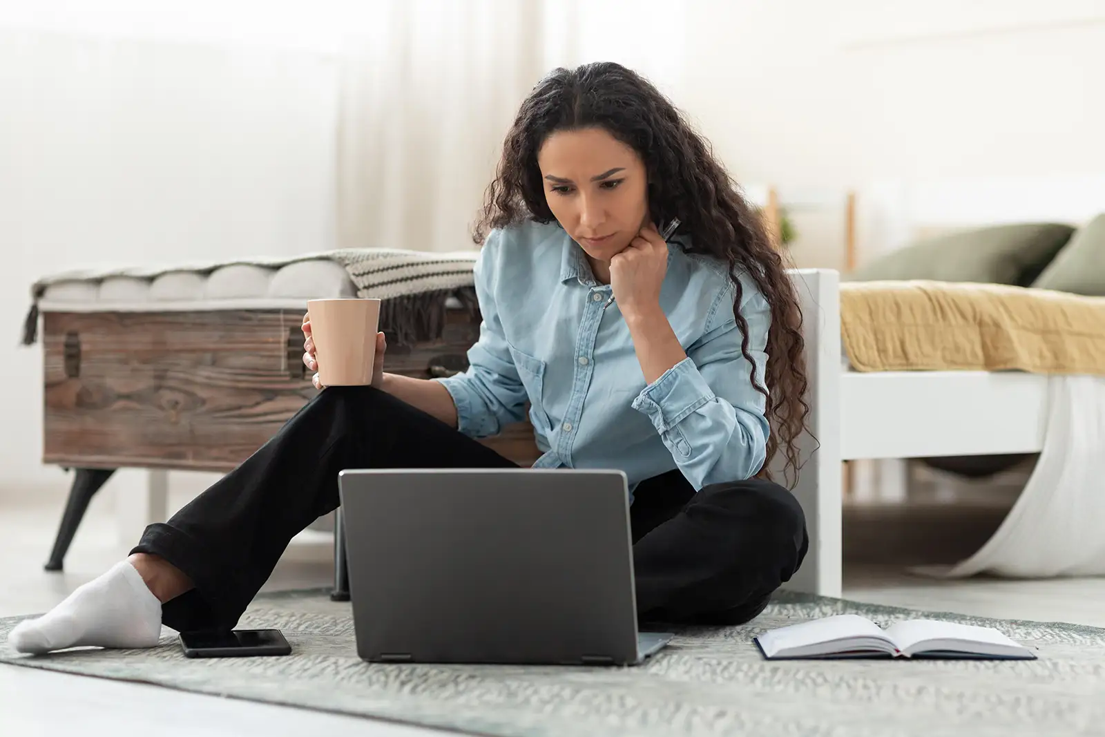 Adult attending a virtual therapy session from home on a laptop