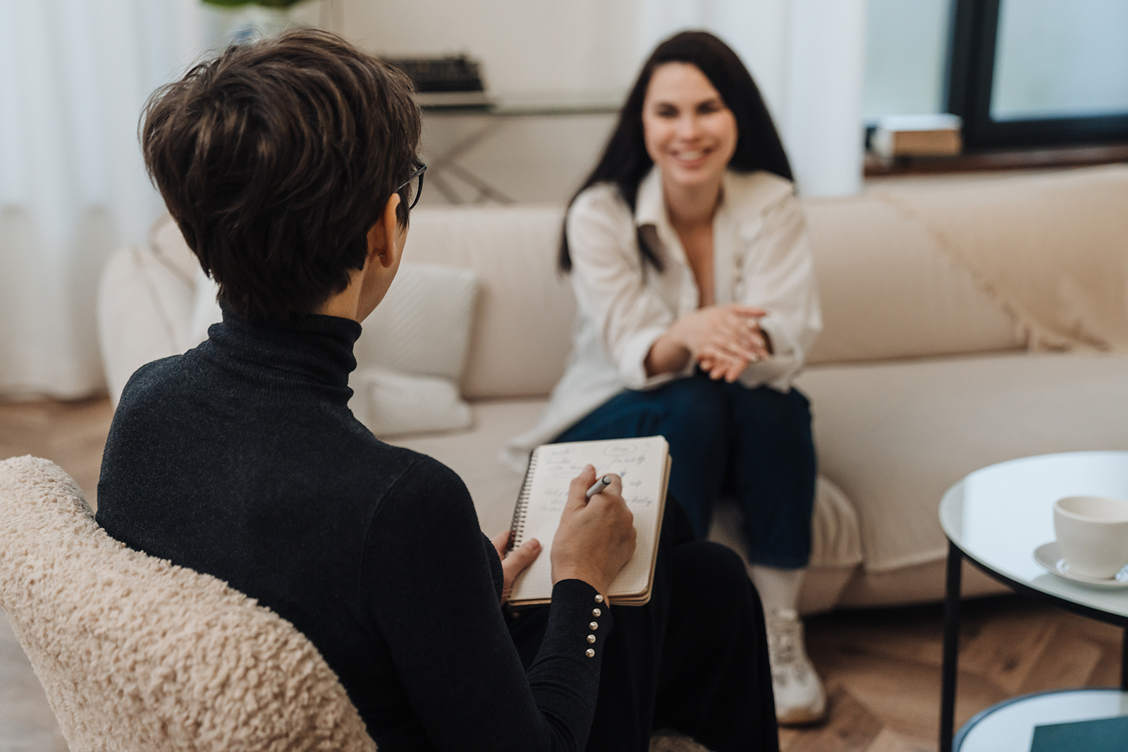 A therapist and client talking during an intensive outpatient therapy session.
